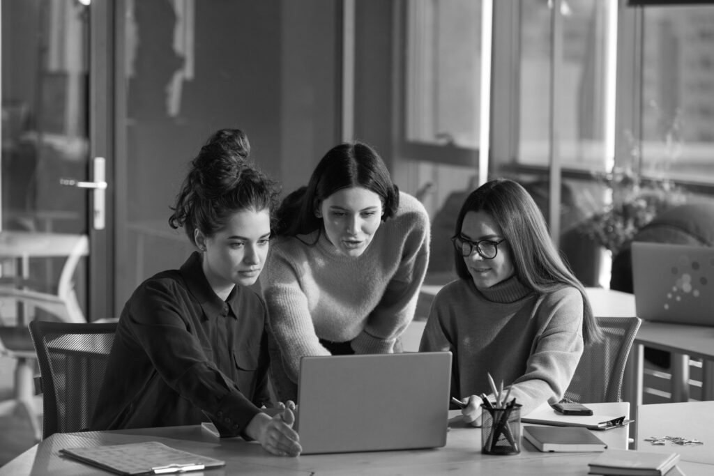 Group Young Women Sitting Table Using Laptop Their Work Office