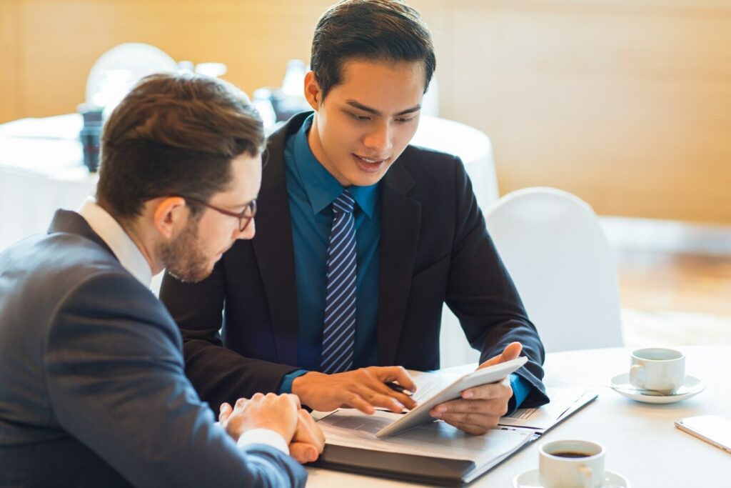 A Mentor And Mentee Discussing Strategies In A Professional Settin